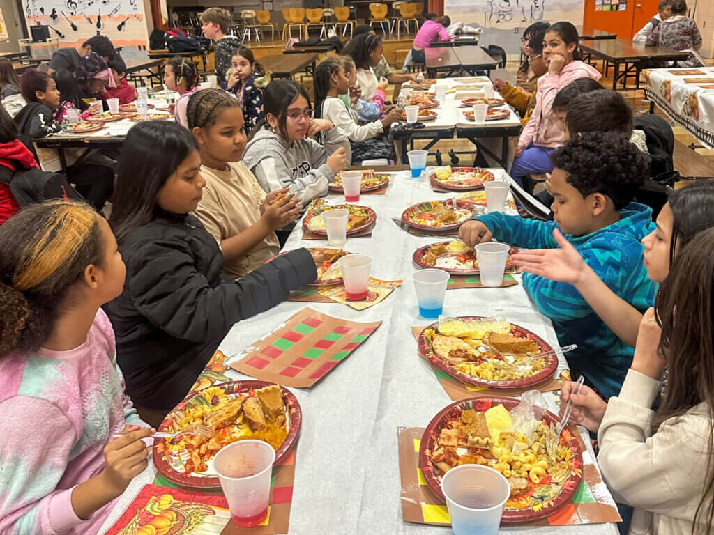 Canterbury Street School students enjoy a Thanksgiving feast.