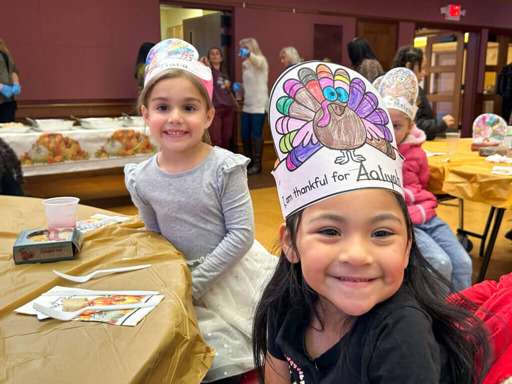 Rice Square students enjoy a Thanksgiving feast at St. Spyridon's Cathedral.