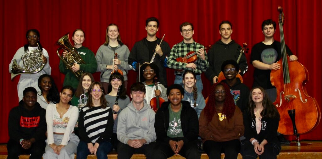Several students holding musical instruments